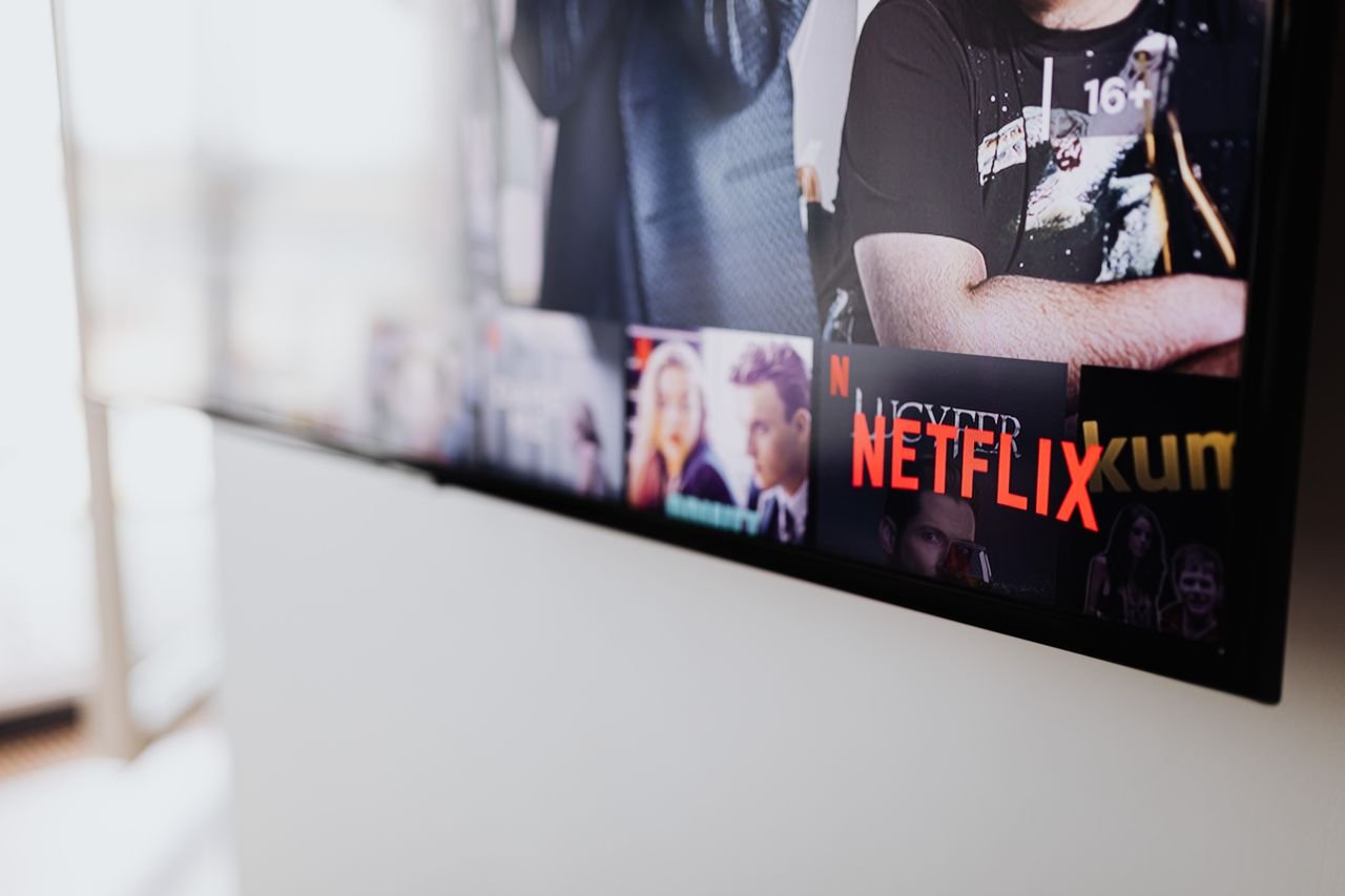 Services Selective focus of a Netflix screen on a smart TV in an indoor setting.